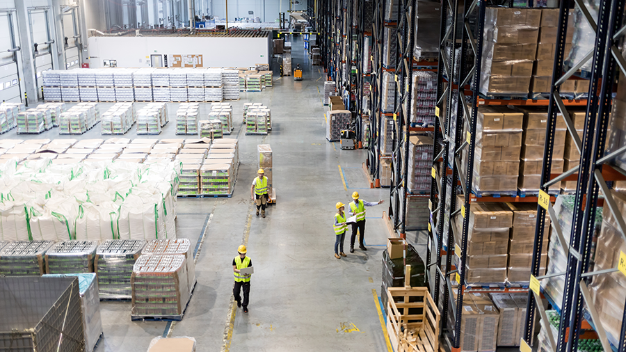 colleagues talking in a manufacturing plant 